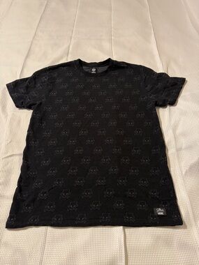 Vans “Simpsons” Black Short Sleeve Crew Neck Tee with Tonal Skull Pattern